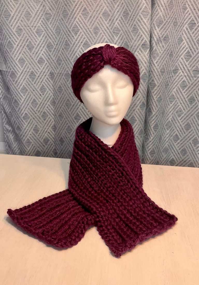 purple ear warmer and scarf on head