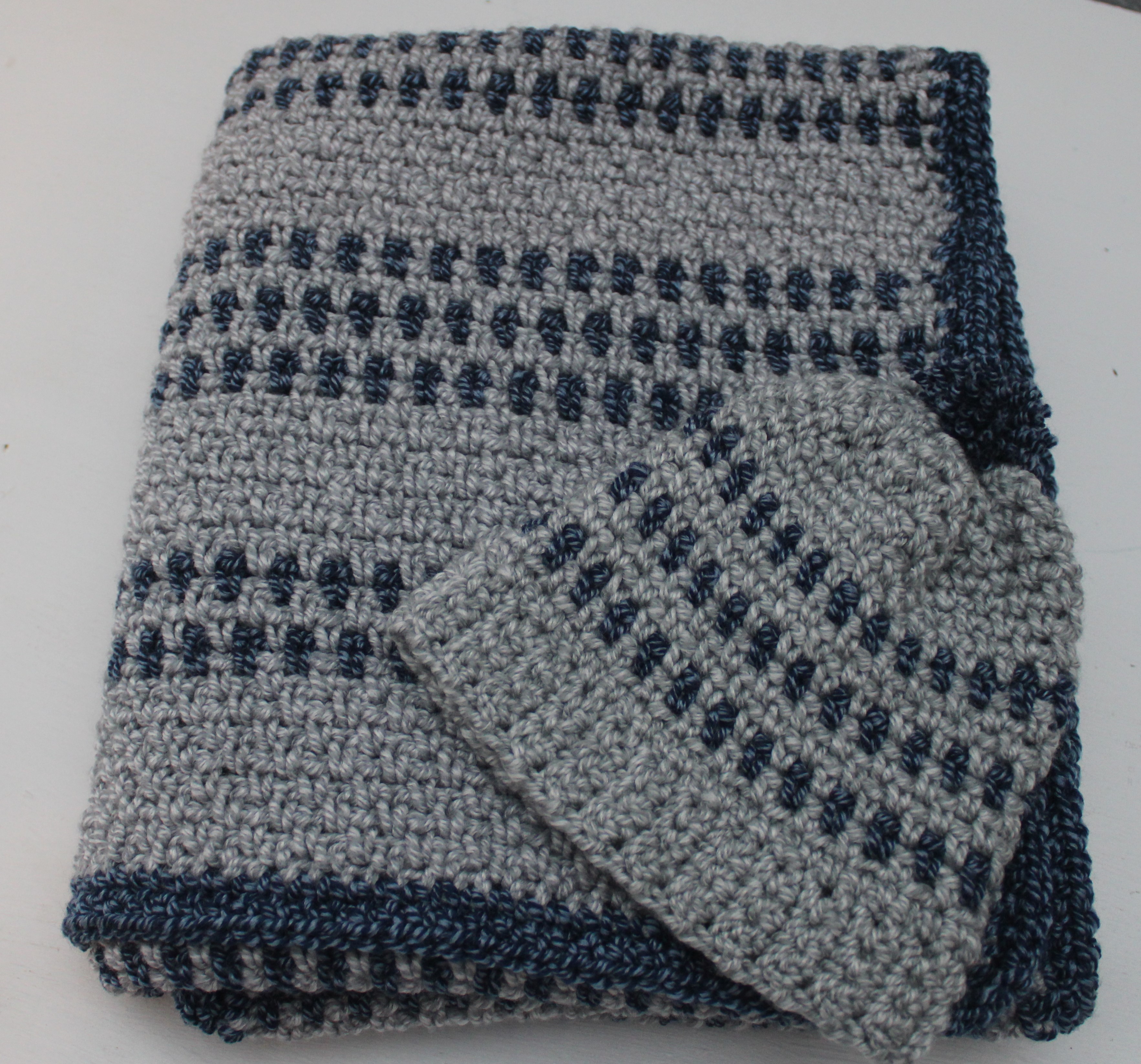 navy and grey folded baby afghan