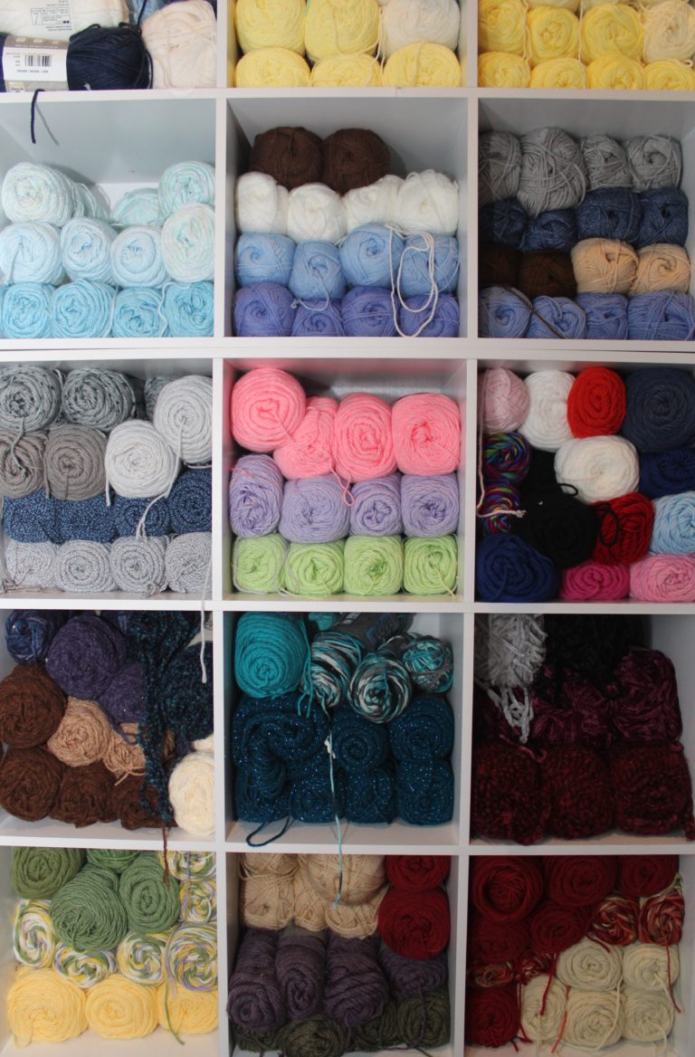 colorful yarn in storage cubbies