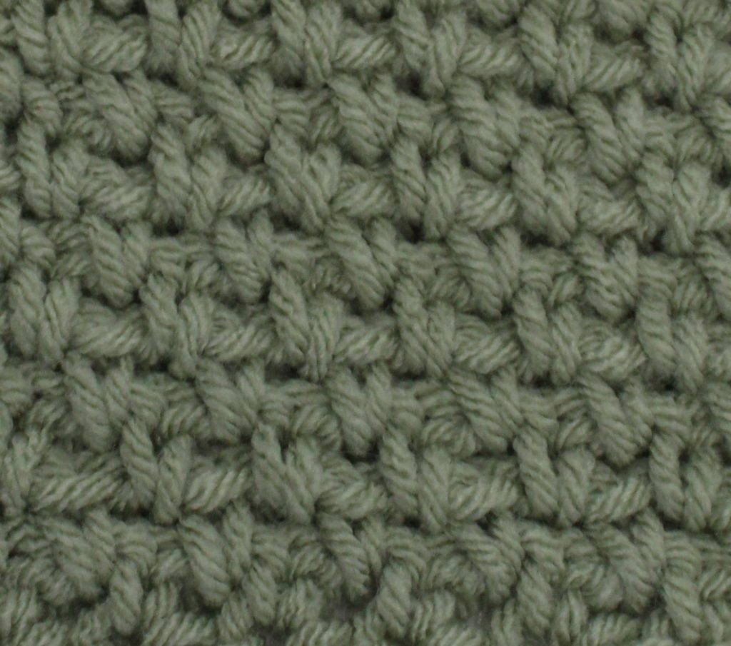 green crochet swatch of the moss stitch