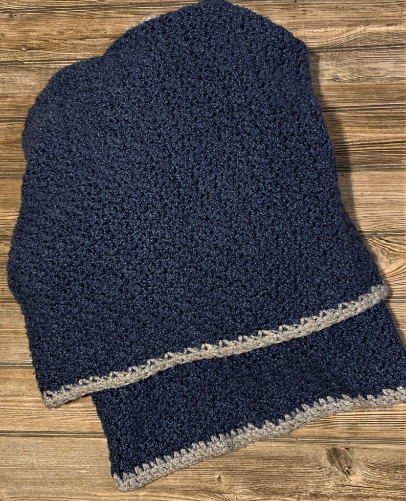 Obsessed with denim crochet throw, navy blue with silver edging.