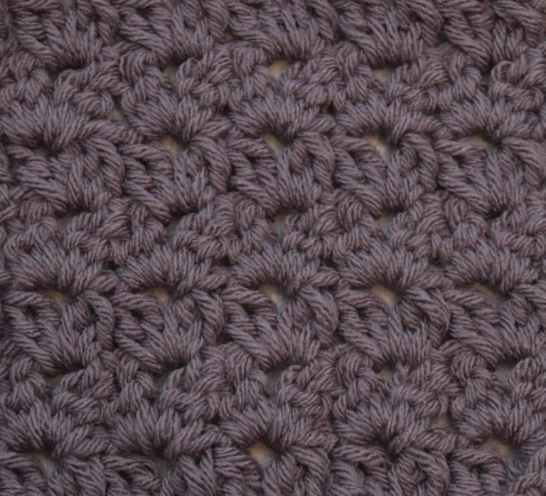 purple crochet swatch showing the dc cluster v-stitch