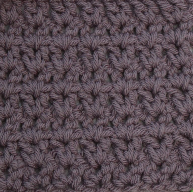 purple crochet swatch showing the no space dc v-stitch