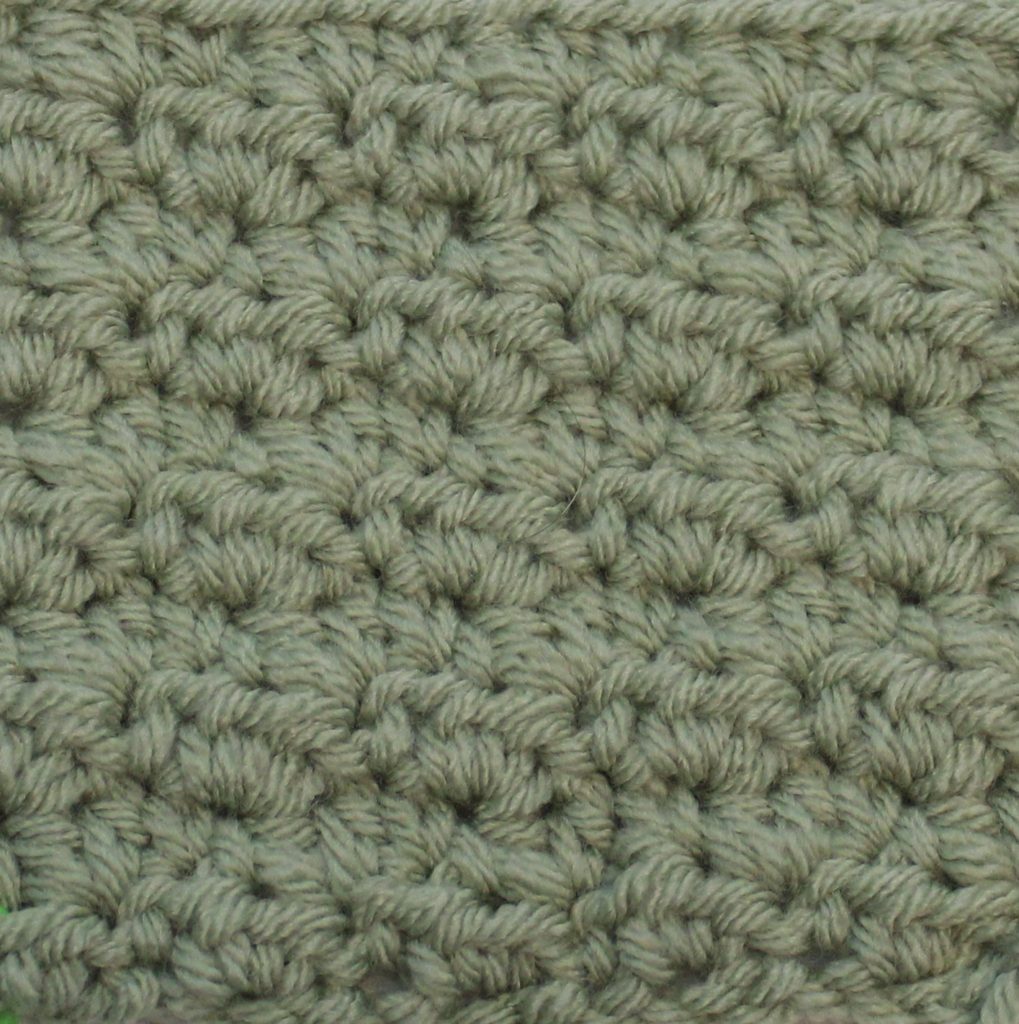 green crochet swatch showing the tiny cloud stitch