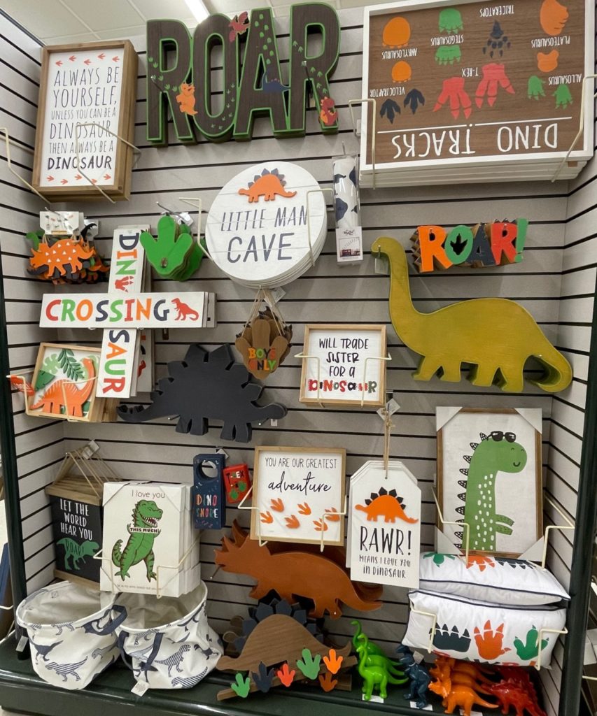 a store display of dinosaur items for decorating a room