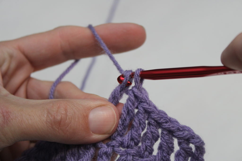 treble crochet pulling through last two loops on hook