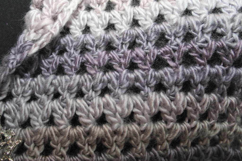 grey and purple forked cluster stitch up close