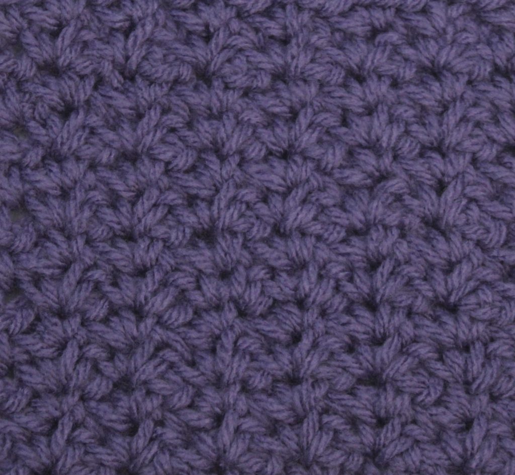 purple crocheted swatch of the spider stitch