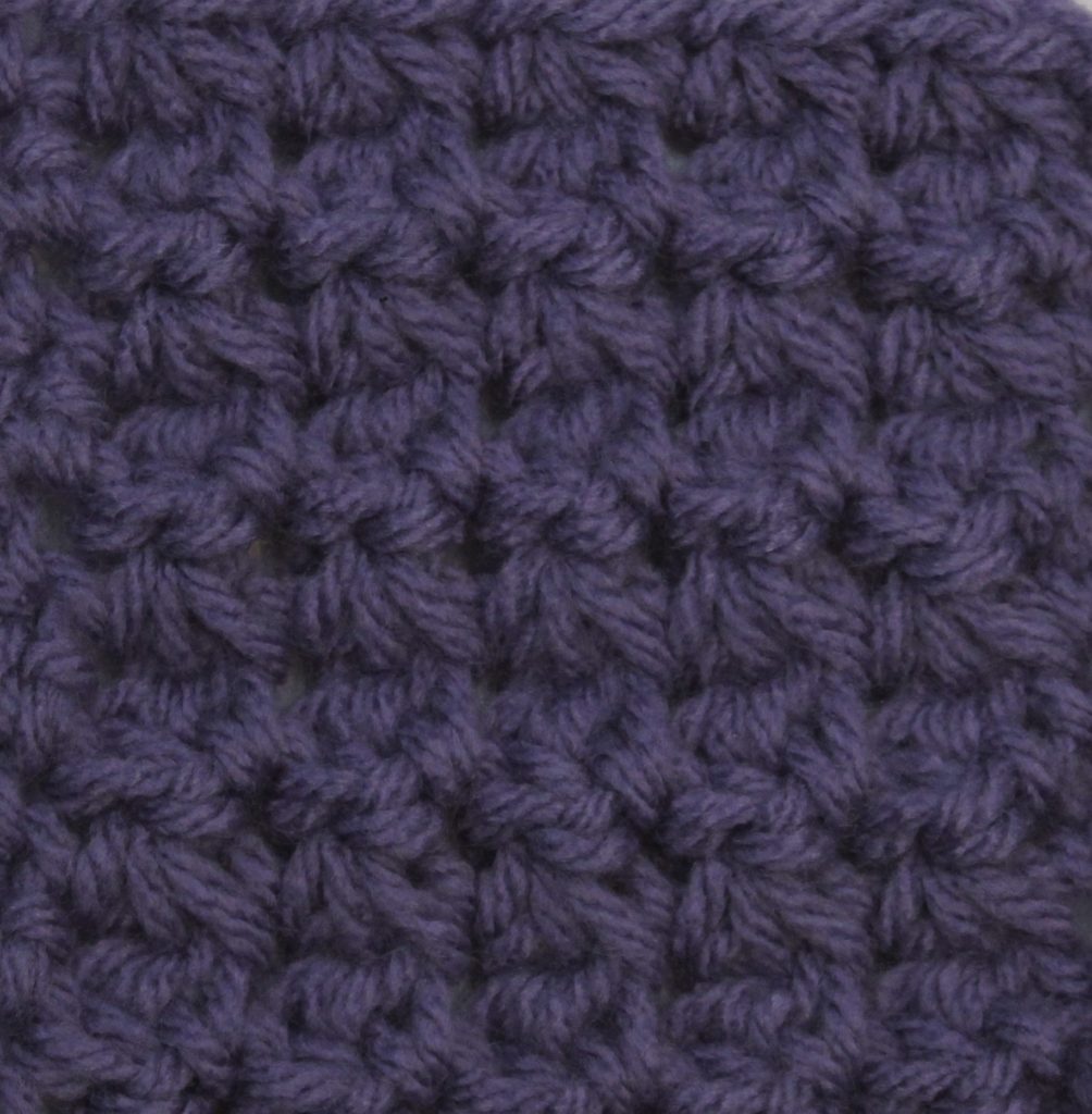 purple crocheted swatch of the trinity stitch