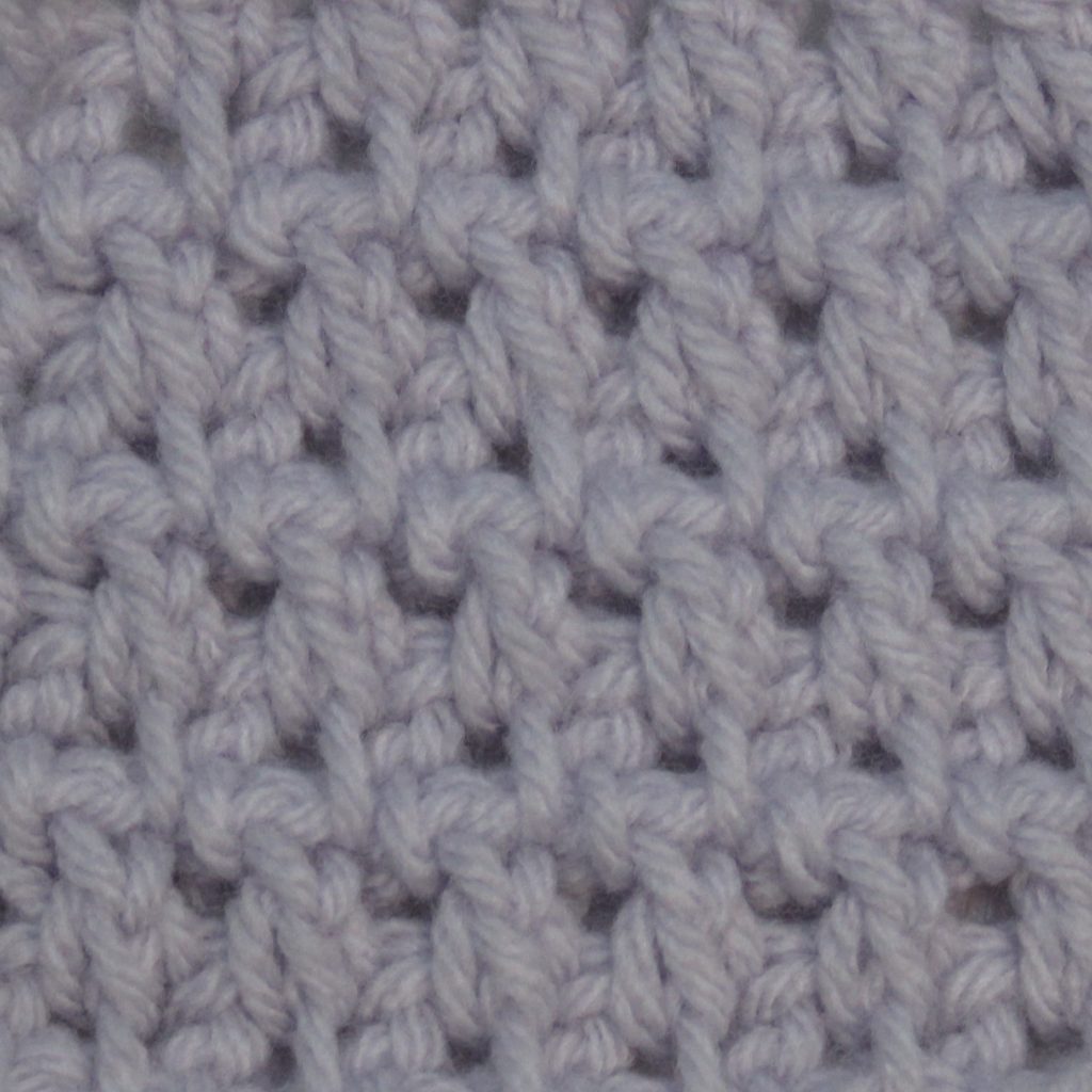 Light purple crocheted swatch of the waffle stitch