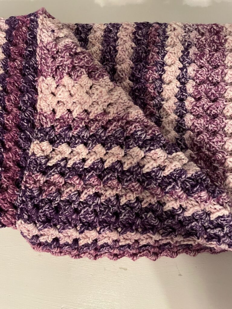 folded Love's ebrace purple shawl 